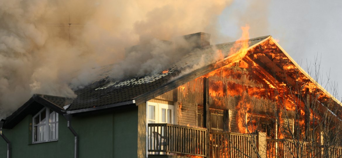 A photograph of a house on fire